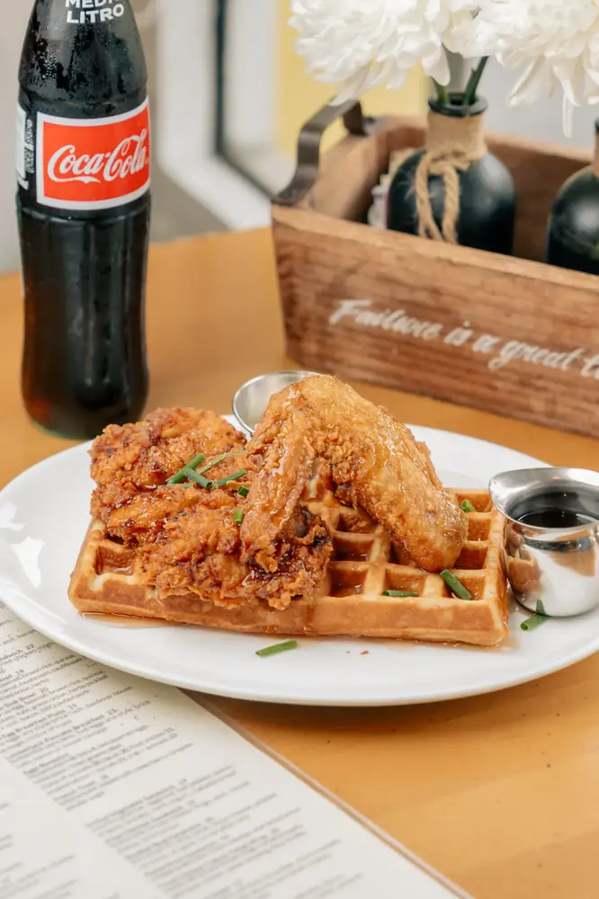 Chicken and waffles plated for a restaurant menu shoot