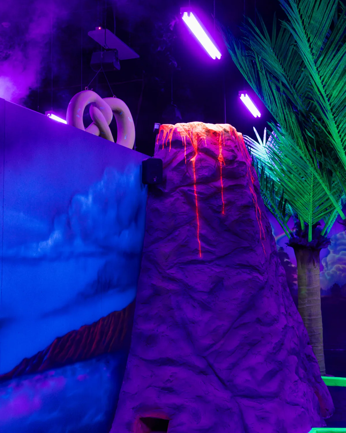 Glow in the dark volcano hole at GLO Mini Golf