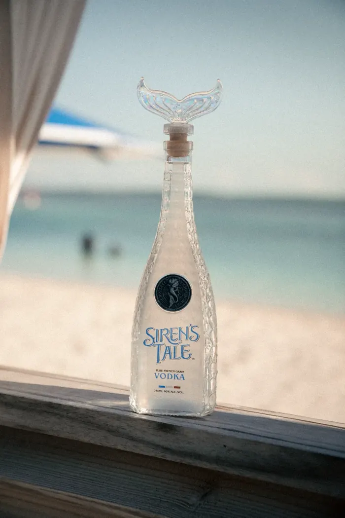 Siren's Tale Vodka bottle on the beach, Swimm product photography